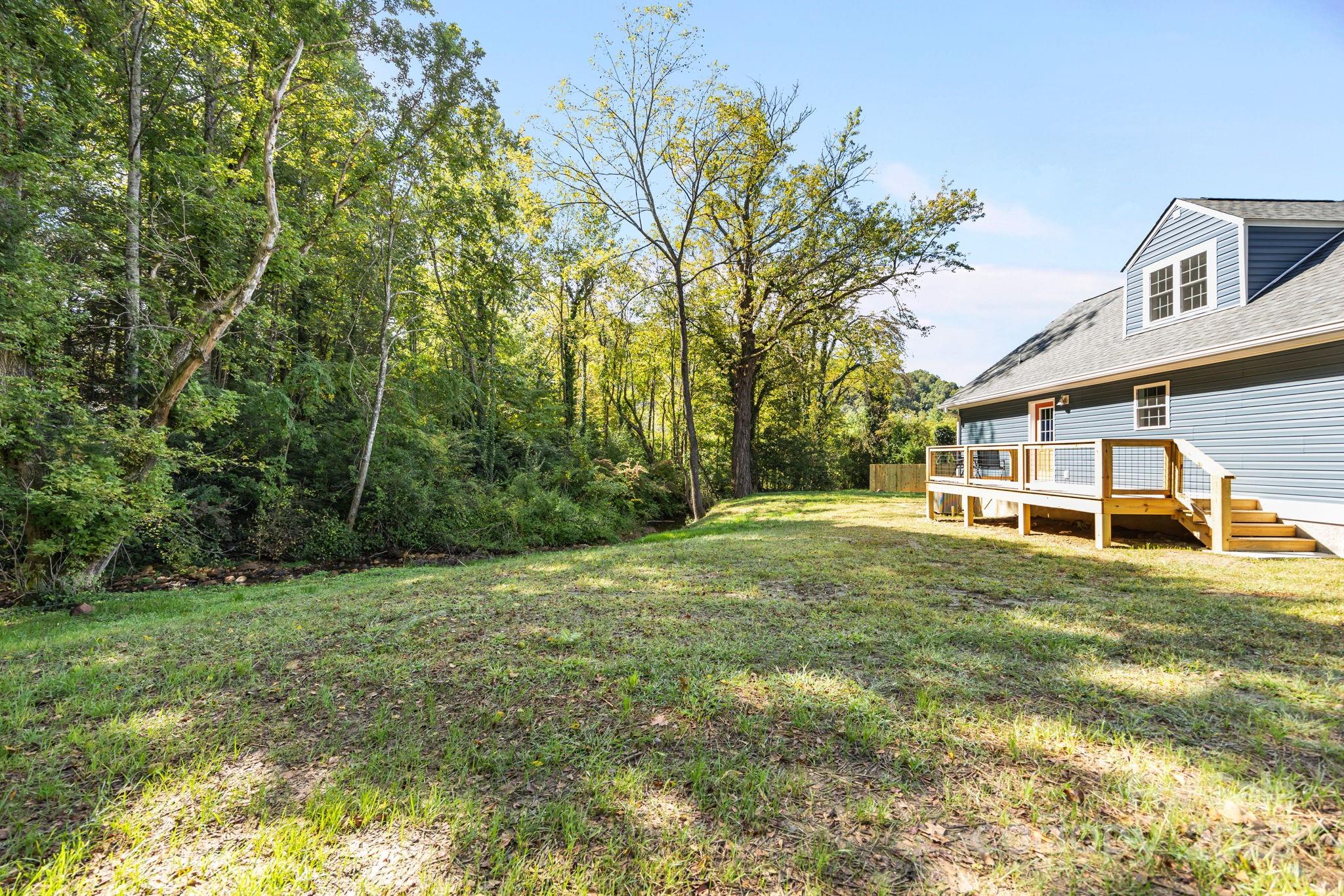 215 McCoy Cove Road Black Mountain, NC 28711 - Photo 13 of 42 a view of a house with a yard