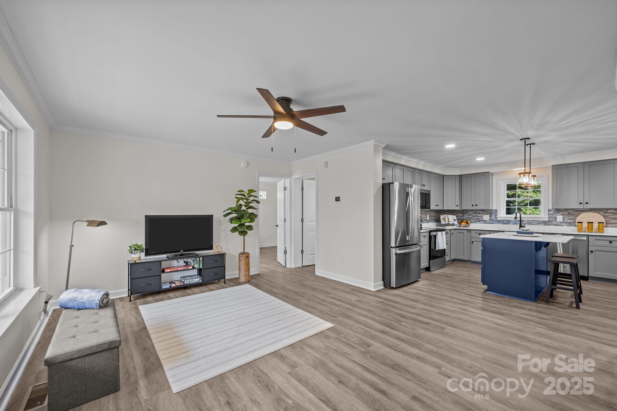 215 McCoy Cove Road Black Mountain, NC 28711 - Photo 17 of 42 a living room with furniture a fireplace and a flat screen tv