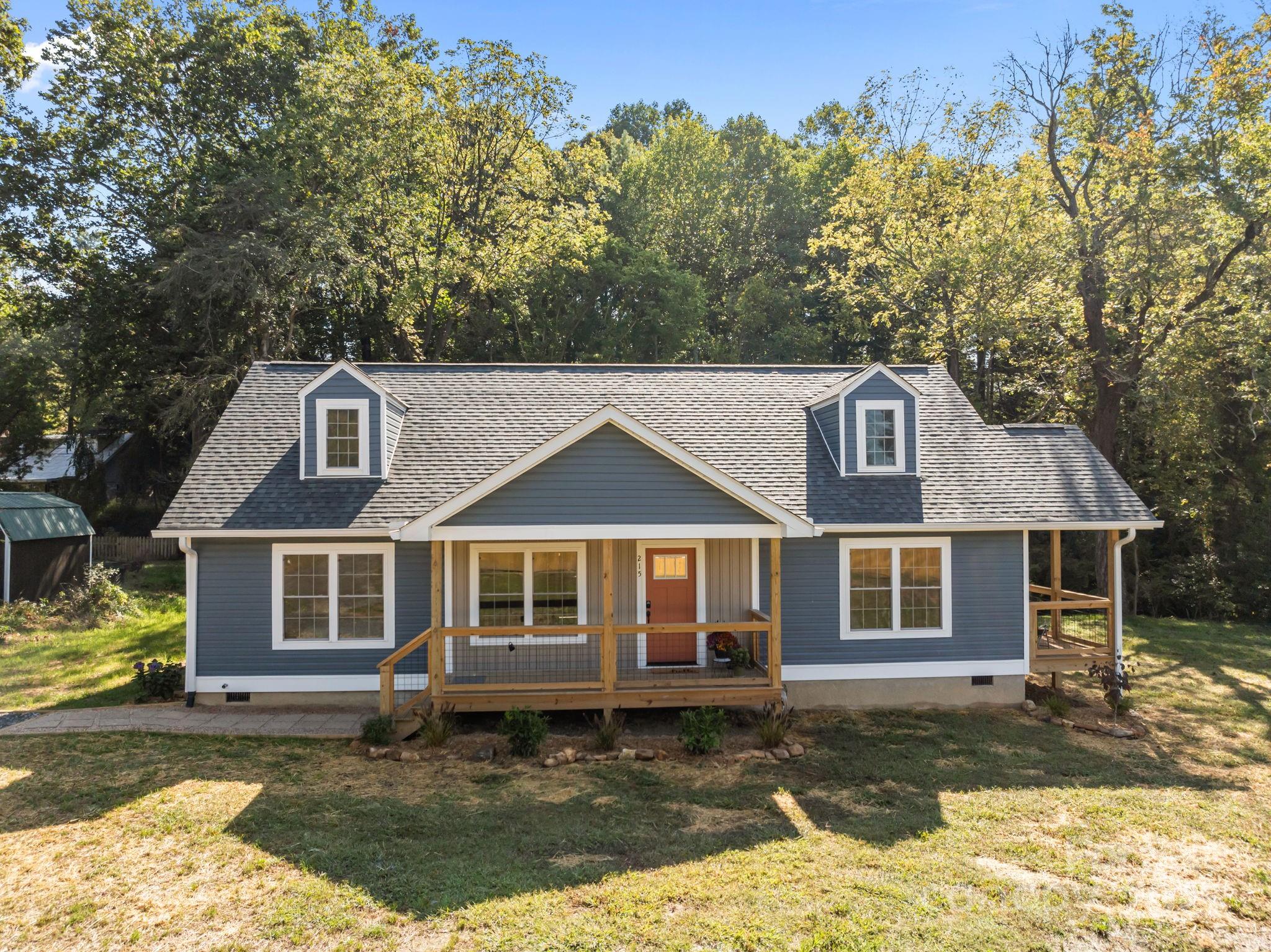 215 McCoy Cove Road Black Mountain, NC 28711 - Photo 2 of 42 a front view of a house with a yard