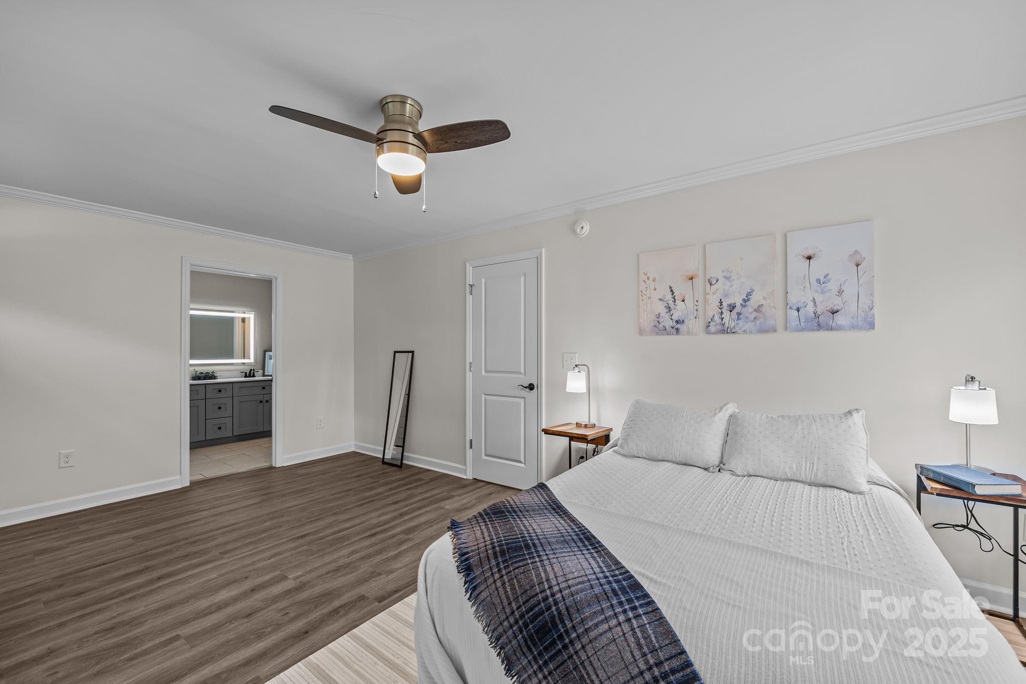 215 McCoy Cove Road Black Mountain, NC 28711 - Photo 27 of 42 a bedroom with a bed and wooden floor