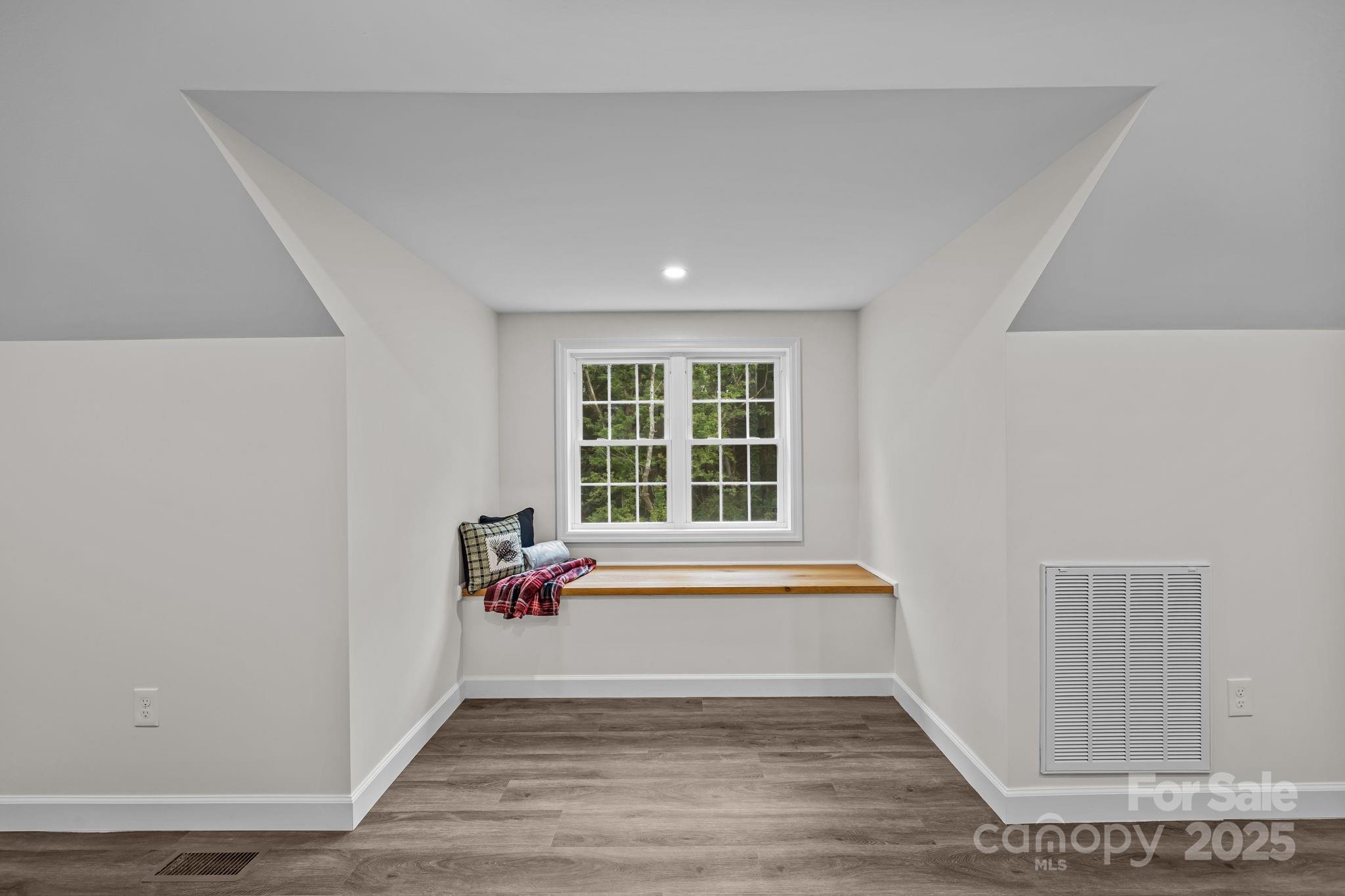 215 McCoy Cove Road Black Mountain, NC 28711 - Photo 35 of 42 a view of empty room with wooden floor and fan