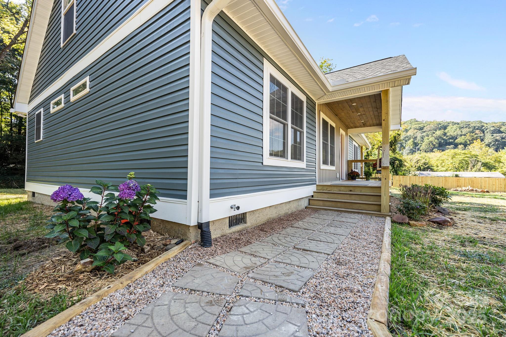 215 McCoy Cove Road Black Mountain, NC 28711 - Photo 6 of 42 a house view with a backyard space