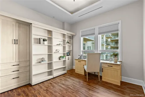 a room with a chair and cabinet