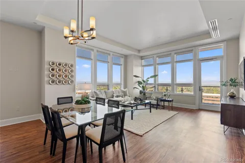 a view of a dining room with furniture window and wooden floor