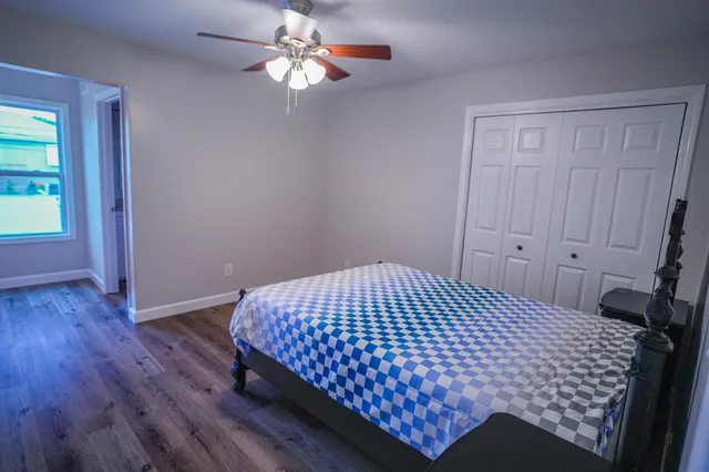 a bathroom with a shower a sink and toilet