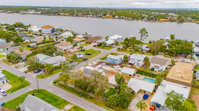 an aerial view of a residential houses with lake view