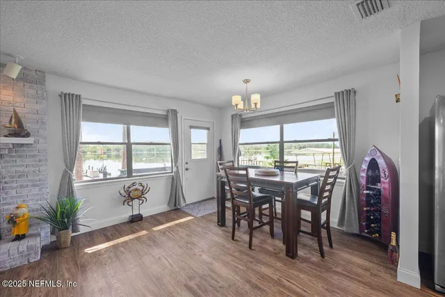 a view of a dining room with furniture window and outside view