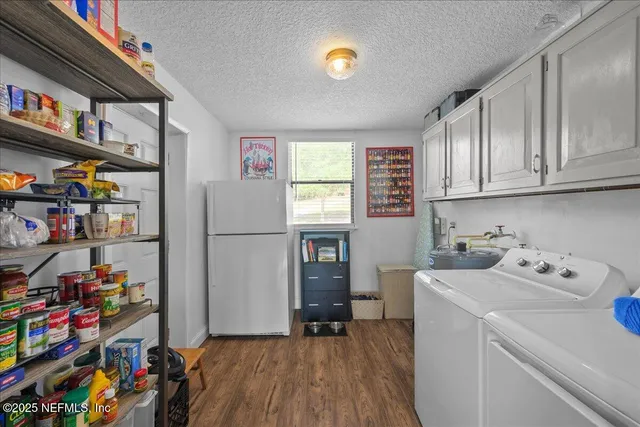 a view of storage and utility room with washer and dryer