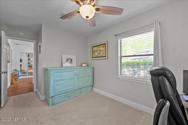 a view of room with window and workspace