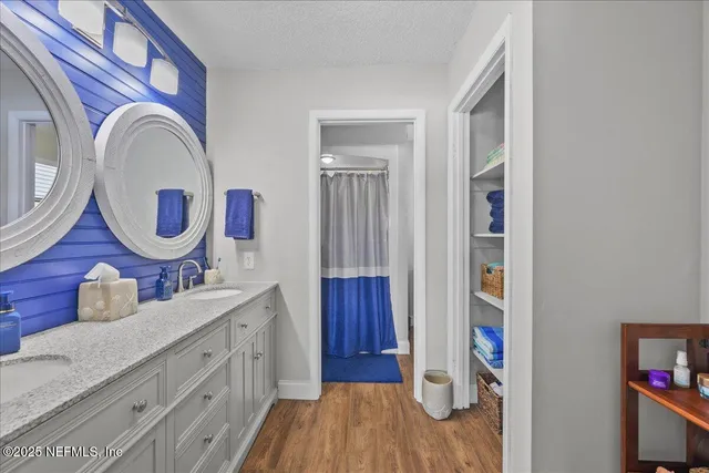 a view of a kitchen with cabinets and wooden floor