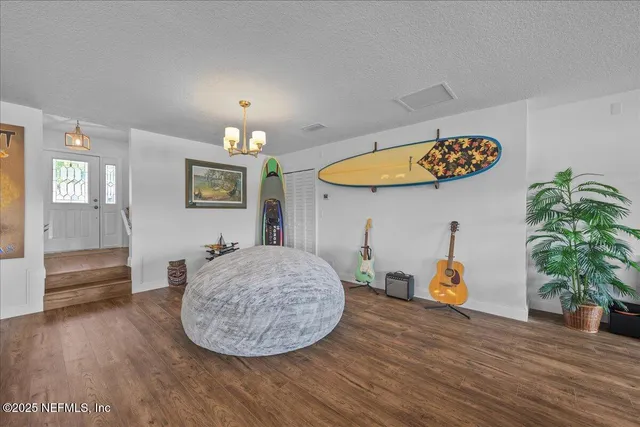 a view of a kitchen with a table and a potted plant
