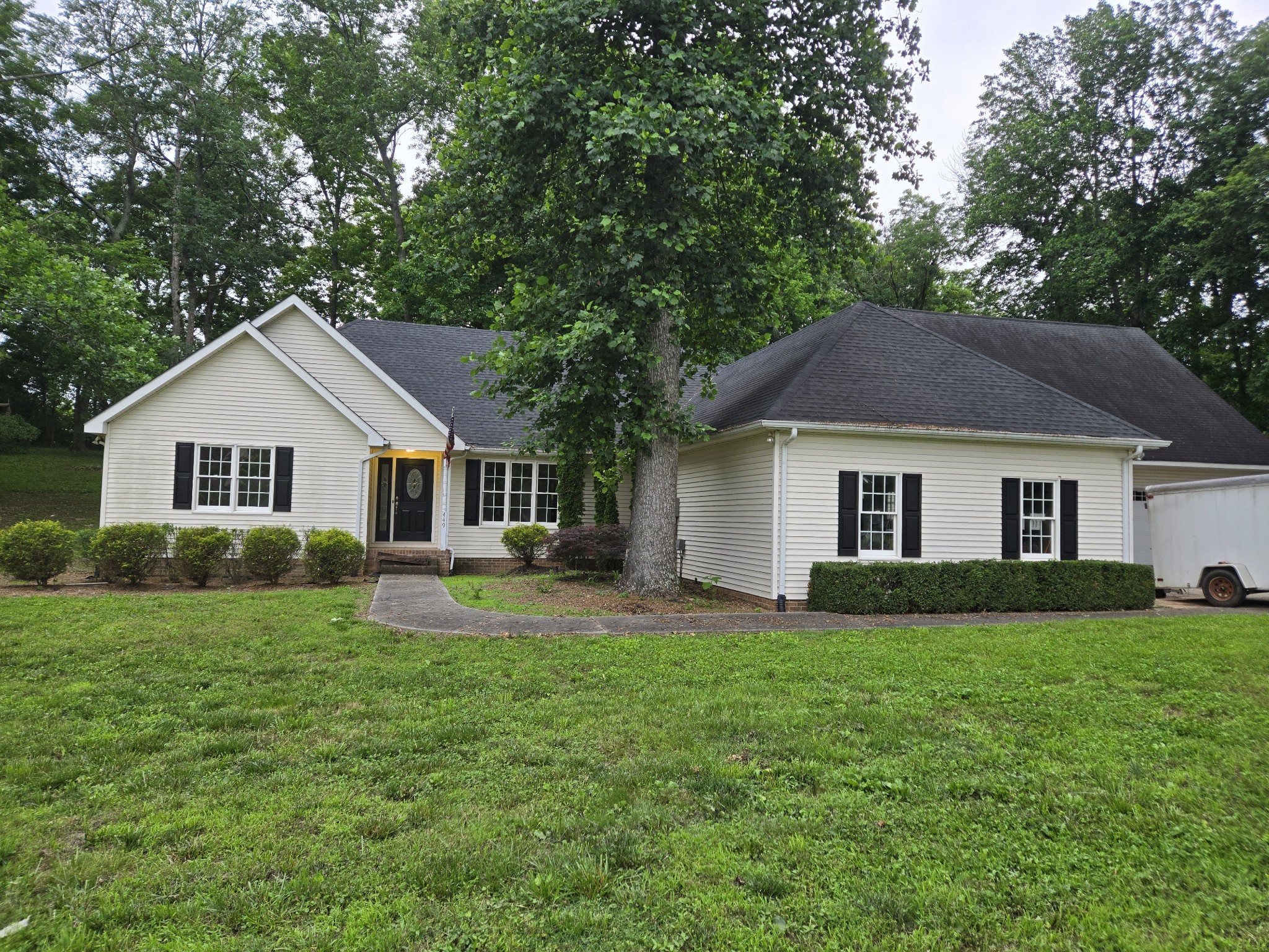 449 Faith-Rae Boulevard Morrison, TN 37357 - Photo 1 of 12 a front view of a house with a yard and trees