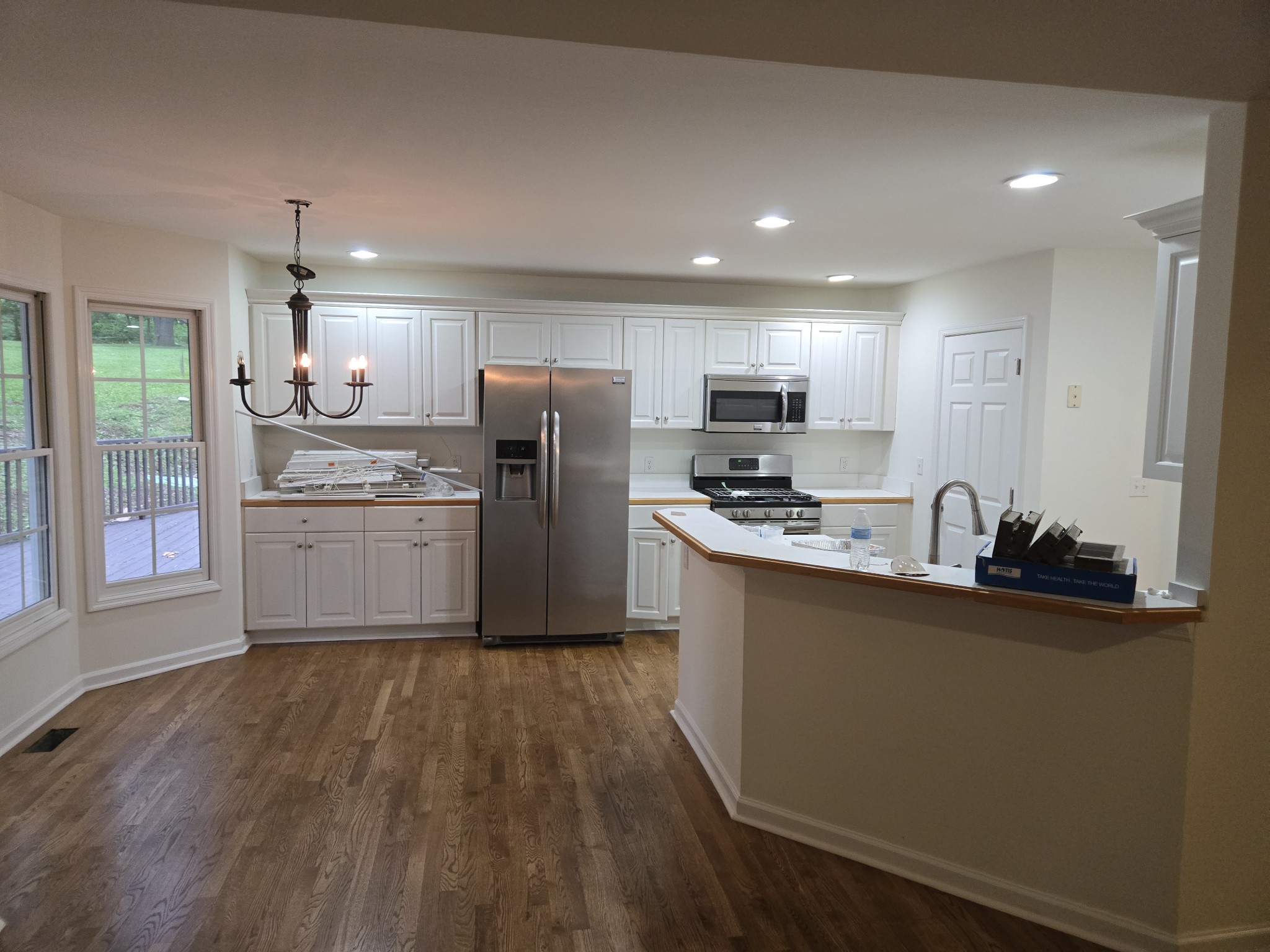449 Faith-Rae Boulevard Morrison, TN 37357 - Photo 7 of 12 a kitchen with a refrigerator a sink a stove a microwave and cabinets