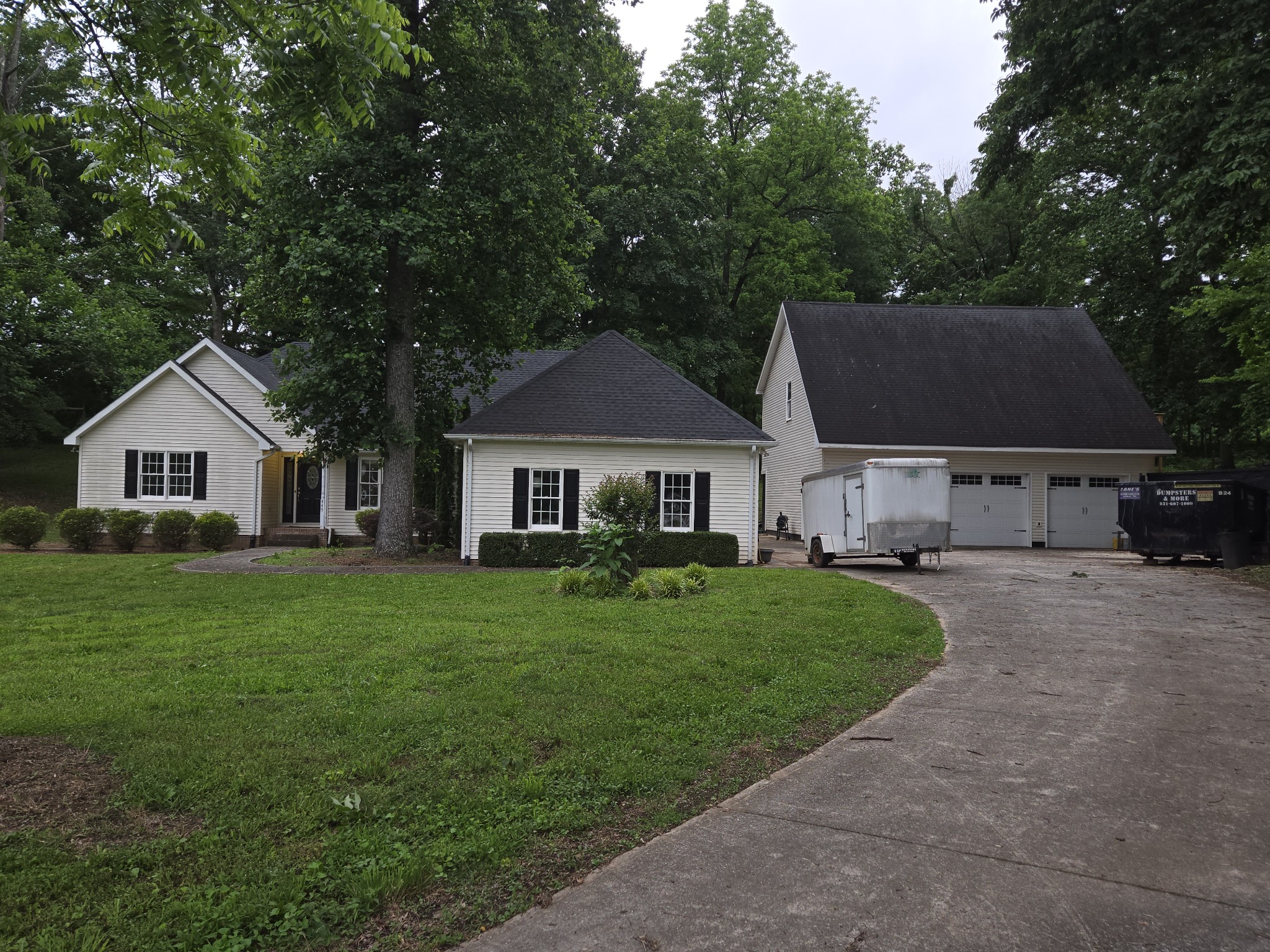 449 Faith-Rae Boulevard Morrison, TN 37357 - Photo 10 of 12 a front view of a house with a garden