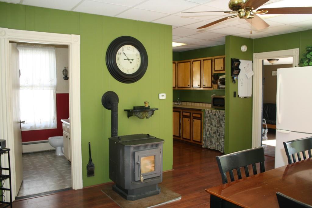 67 Pleasant Street Springvale, ME 04083 - Photo 9 of 35 Pellet stove keeps kitchen warm and...