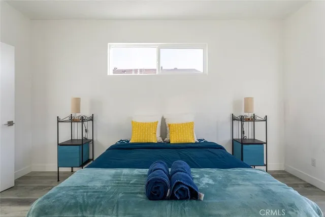 a bedroom with a bed and dresser