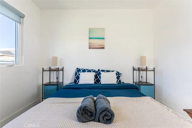 a bedroom with a bed and a table