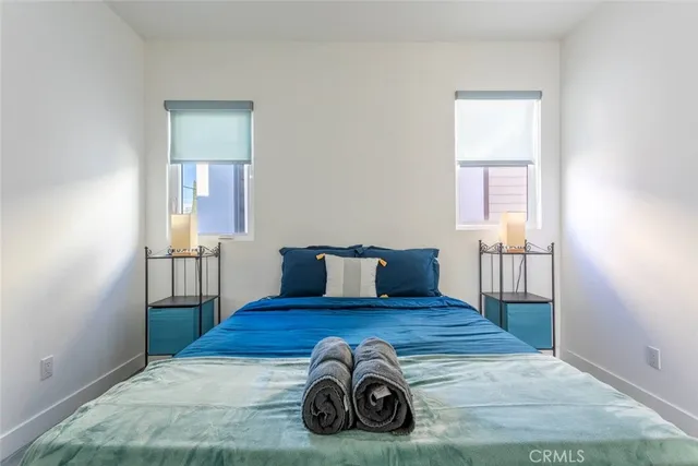 a view of a livingroom with wooden floor and a window