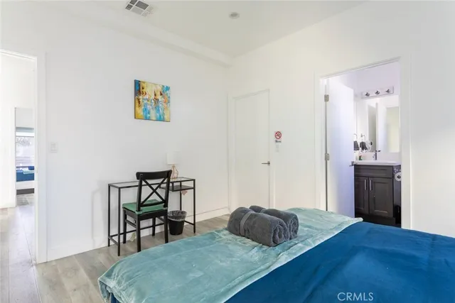 a bedroom with a bed and a table in it