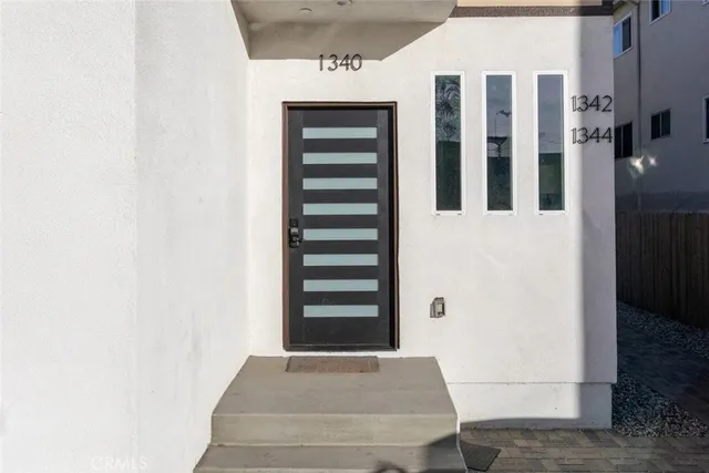 a view of wooden door with a window