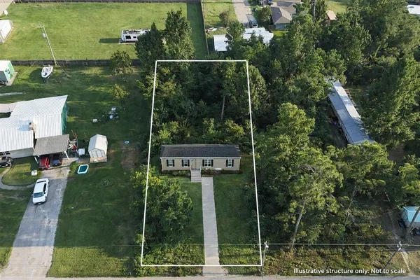 an aerial view of house with yard