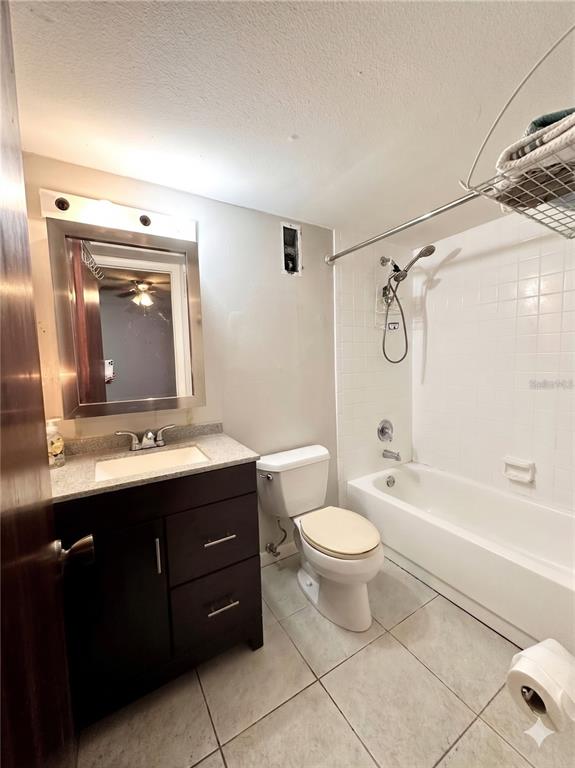 912 Lake Destiny Road, Unit F Altamonte Springs, FL 32714 - Photo 5 of 12 a bathroom with a double vanity sink toilet mirror and bathtub
