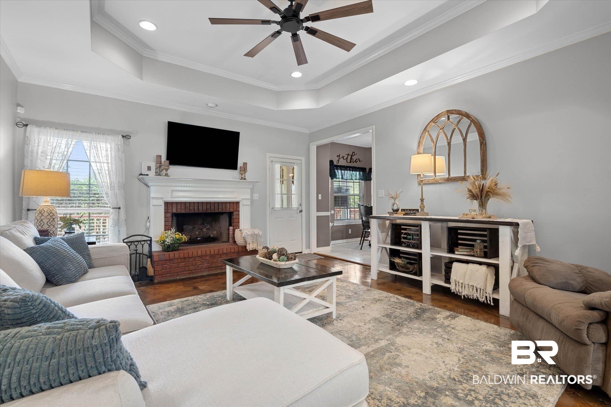 3170 Scott Dairy Loop Road West Mobile, AL 36695 - Photo 2 of 24 Living area featuring a tray ceiling, recessed lighting, and wood-finish flooring