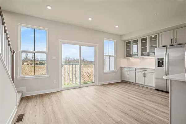 a large kitchen with cabinets