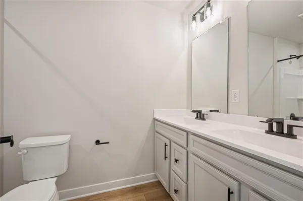 a bathroom with a bathtub a toilet and a shower