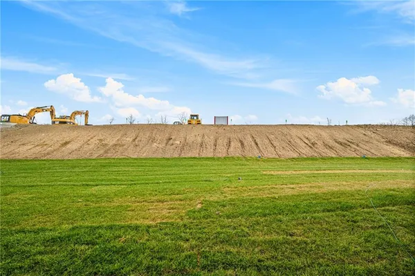 a view of a building with a yard