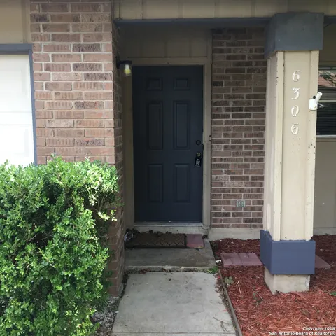 a front view of a house with stairs