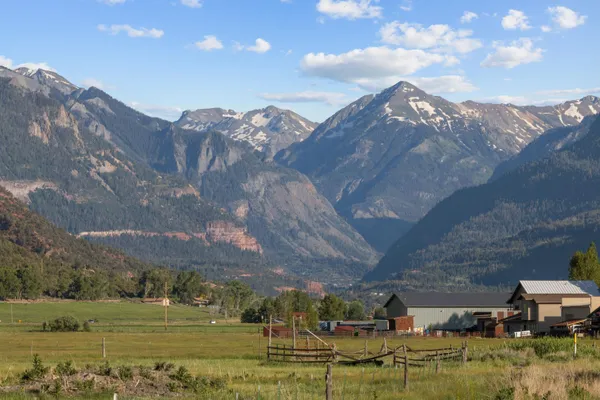 a view of a town with mountains