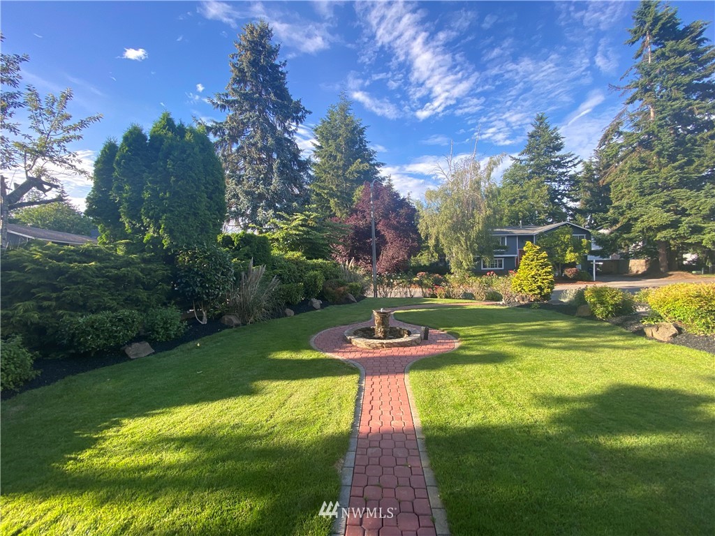 718 222nd Street Southwest Bothell, WA 98021 - Photo 22 of 22 a view of a fountain in a yard with palm trees