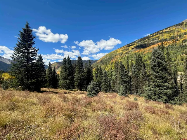 a view of an ocean and a yard