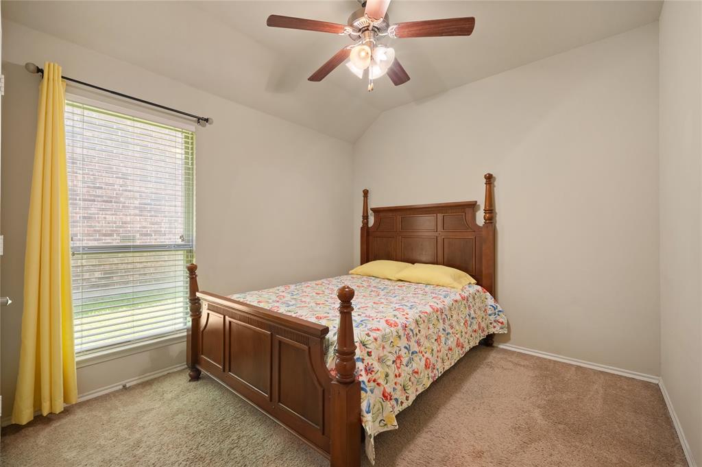 520 Rustic Oak Lane McKinney, TX 75072 - Photo 24 of 30 Interior room featuring neutral wall paint, vaulted ceiling, and a ceiling fan with integrated lighting
