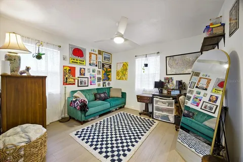 a living room with furniture and a rug