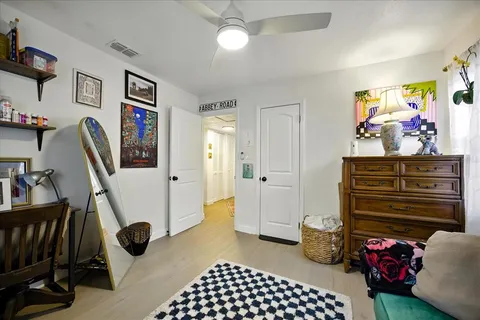 a bedroom with furniture and a window