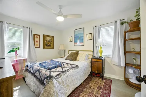 a bed room with a bed and a tv