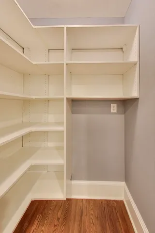 a bathroom with a toilet and a mirror