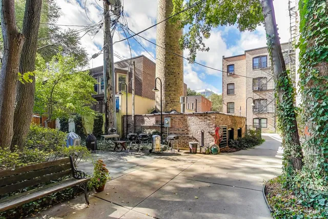 a view of an outdoor sitting area with furniture