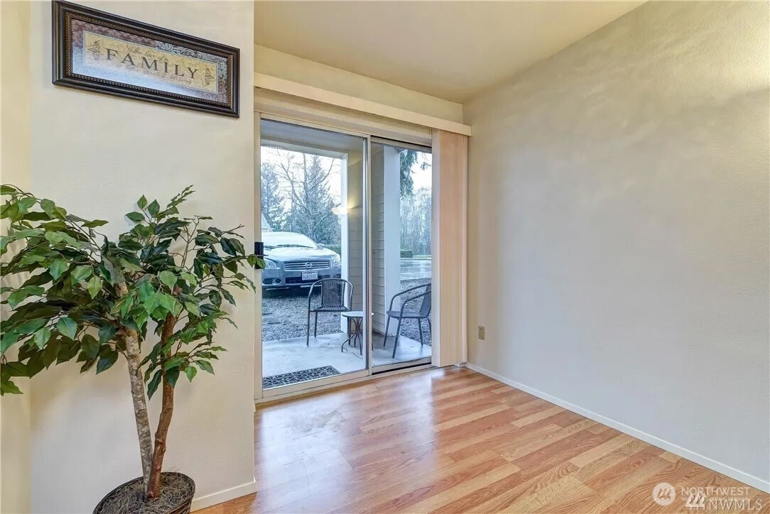 5300 Harbour Pointe Boulevard, Unit 304C Mukilteo, WA 98275 - Photo 13 of 19 an entryway with wooden floor and a potted plant