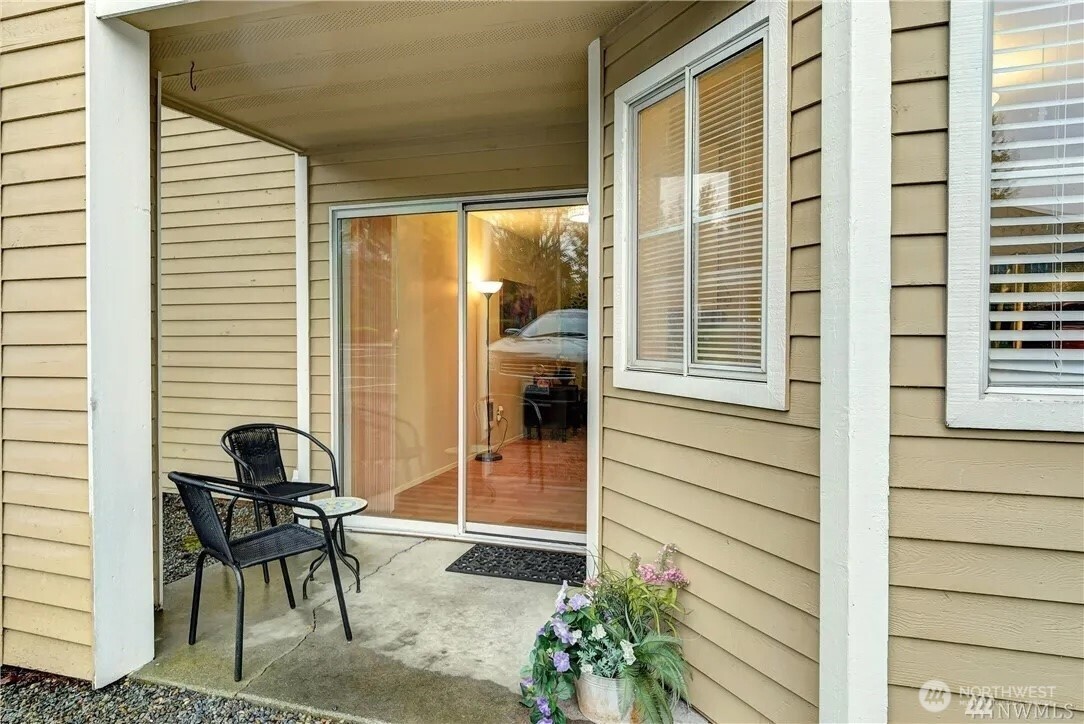 5300 Harbour Pointe Boulevard, Unit 304C Mukilteo, WA 98275 - Photo 14 of 19 a porch with a bench and a chair