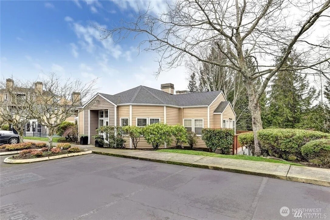5300 Harbour Pointe Boulevard, Unit 304C Mukilteo, WA 98275 - Photo 15 of 19 a front view of a house with a yard and garage