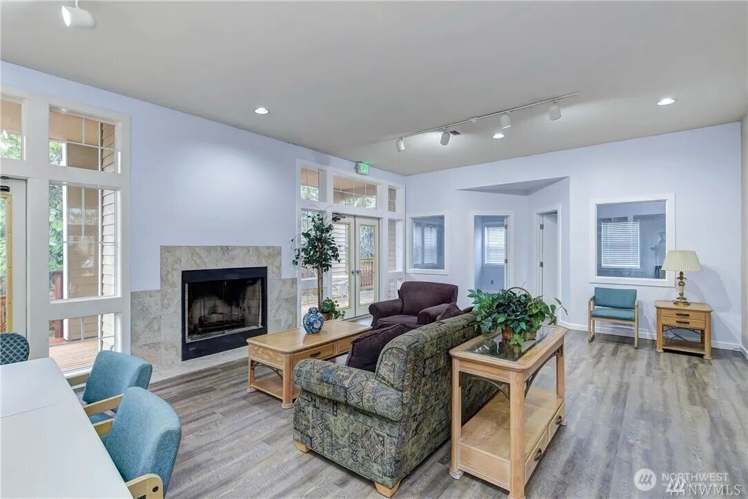 5300 Harbour Pointe Boulevard, Unit 304C Mukilteo, WA 98275 - Photo 17 of 19 a living room with furniture and a fireplace