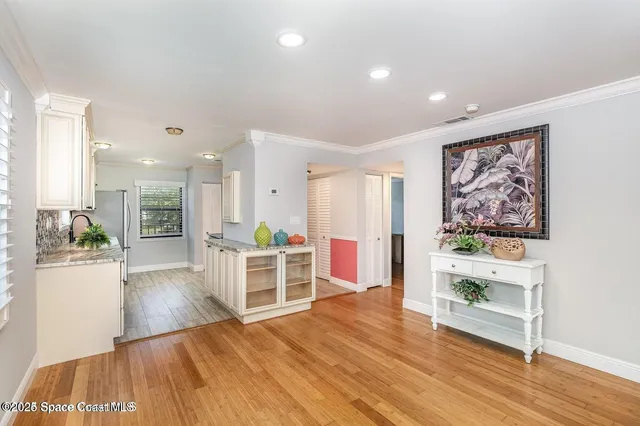 a view of a living room and wooden floor