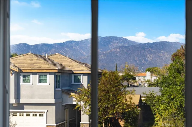 a view of a house with a yard and fountain