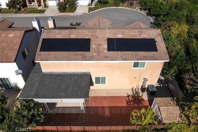 a view of a city with lush green forest