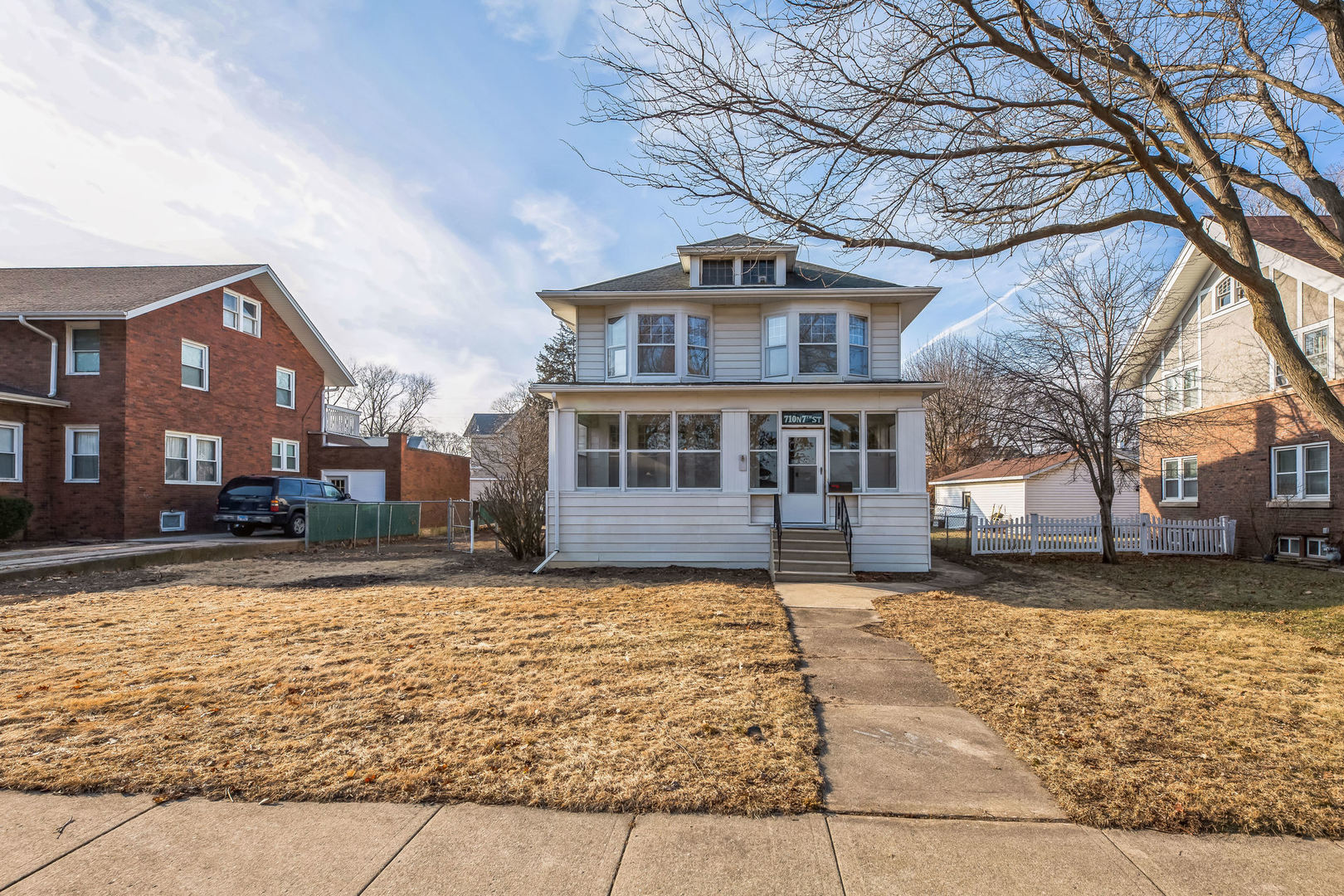 710 North 7th Street Rochelle, IL 61068 - Photo 2 of 32 a front view of a house with a yard