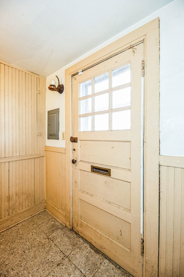 710 North 7th Street Rochelle, IL 61068 - Photo 28 of 32 a view of a small space with wooden floor and a window