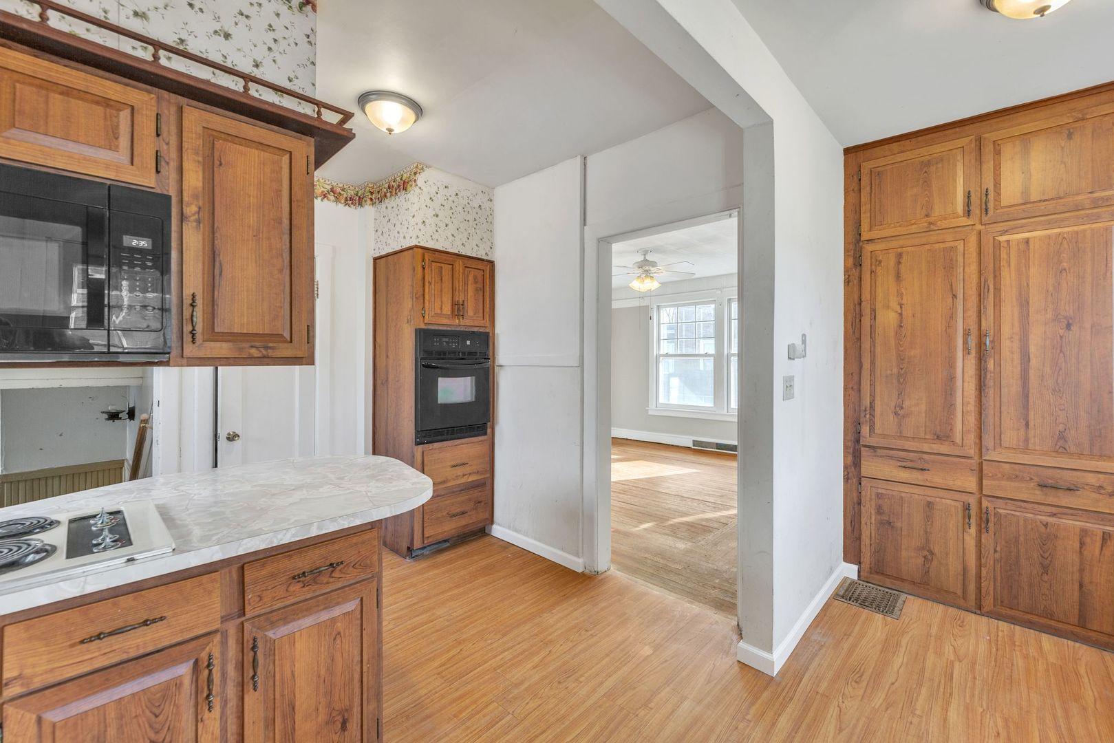 710 North 7th Street Rochelle, IL 61068 - Photo 8 of 32 a kitchen with granite countertop wooden cabinets and entryway